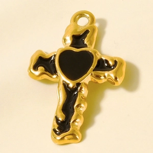 Macro detail of a 304 stainless steel cross pendant with black oil drip heart design