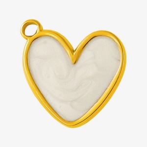 Macro shot of gold-plated stainless steel heart charm with white enamel and top hanging loop