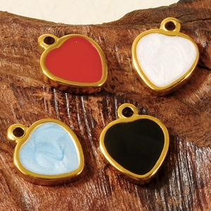 Macro detail of heart-shaped stainless steel charms with colorful enamel for DIY jewelry
