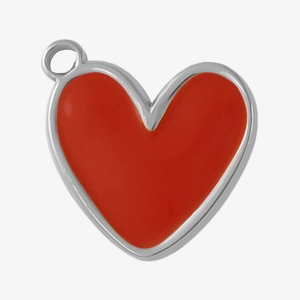 Detailed close-up of a small heart-shaped red enamel pendant with silver metal edges