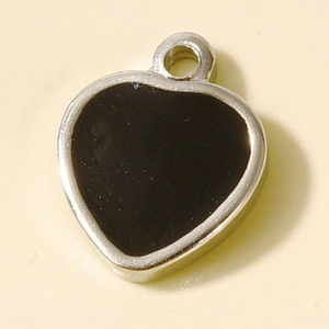 Macro shot of 304 stainless steel heart pendant with black enamel inlay for DIY jewelry