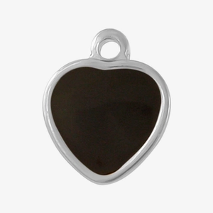 Macro detail of heart-shaped pendant with black oil drip inlay and silver stainless steel rim