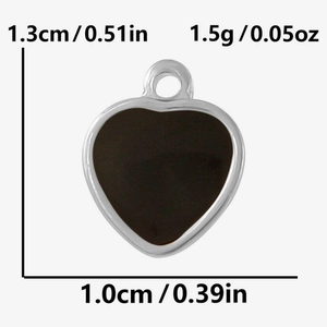 Macro shot of heart charm pendant in stainless steel with size and weight dimensions