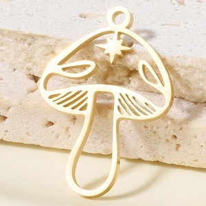 Macro detail of golden 304 stainless steel mushroom pendant with star cutouts