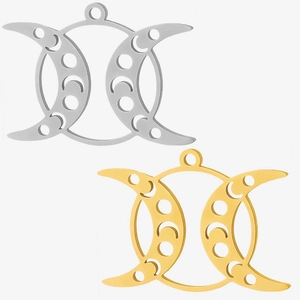Detailansicht von hohlen Mondsichelphasen-Anhängern aus goldenem und silbernem Edelstahl