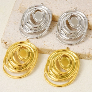 Detail of 304 stainless steel spiral oval pendant bases in gold and silver for DIY jewelry