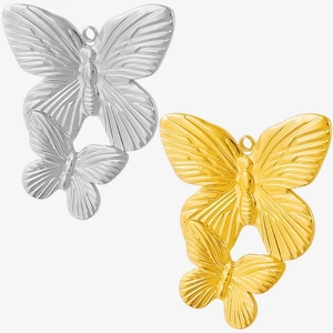 Dettaglio di ciondoli a farfalla in acciaio inossidabile 304 oro e argento con texture