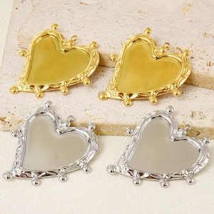 DIY jewelry making supplies showing 304 stainless steel heart pendants in gold and silver