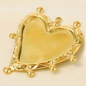 Detail of 304 stainless steel heart pendant with hammered texture and golden beads