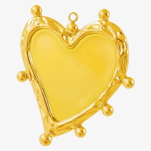 Macro view of gold stainless steel heart pendant with textured edges and metal beads