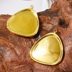 Polished 304 stainless steel teardrop pendants for DIY jewelry making on wooden background