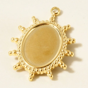 Macro detail of sun pendant with oval setting tray for DIY jewelry making