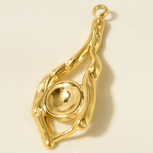 Detail of a 304 stainless steel gold irregular organic pendant with a round bezel base