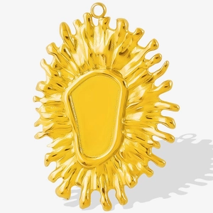 Macro detail of gold-plated stainless steel flower petal pendant for jewelry making