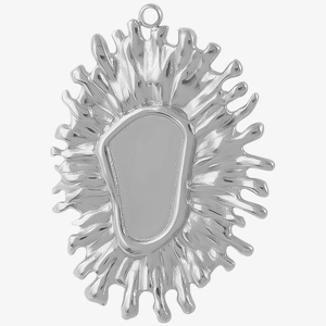 Macro detail of irregular silver stainless steel flower pendant with smooth polished finish