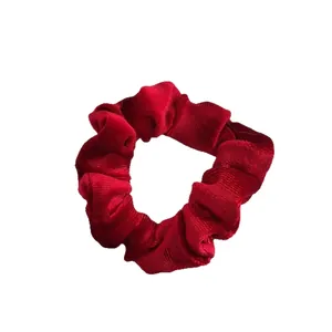 Elegant wine red velvet scrunchie with pleated texture for festive ponytail styling