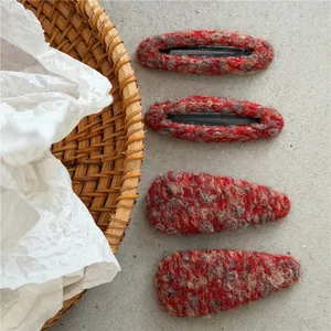 Set of four red woolen tweed hair clips including oval and teardrop shapes for women