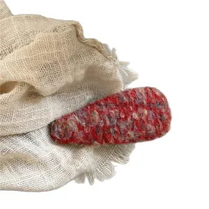 Elegant handcrafted red wool blend water-drop hair clip with retro textured finish