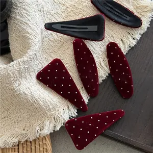 Red velvet polka dot hair clips in triangle and oval shapes with vintage BB clip design