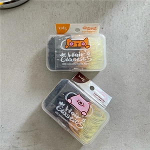Detail of high elasticity hair bands in a transparent box with cartoon cat packaging