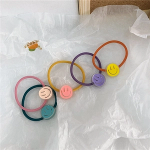 Set of five colorful elastic hair ties with cute cartoon smiley face acrylic charms