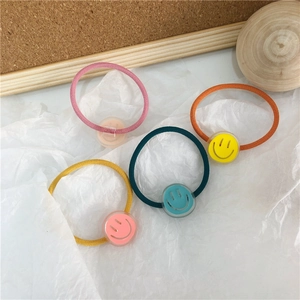 Set of four colorful elastic hair ties with cute translucent smiley face charms