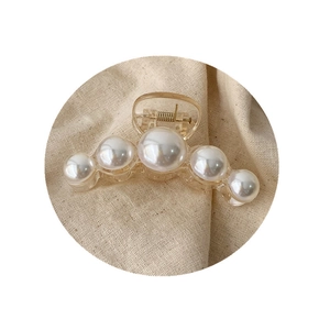 Elegant transparent hair claw clip with five white pearls and golden spring mechanism