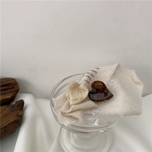Elegant heart-shaped acetic acid hair clips in cream marble and dark tortoiseshell finish