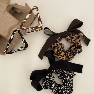 Elegant leopard print hair scrunchies with bow and textured geometric hair clips set