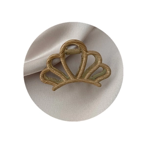 Retro geometric crown hair claw clip with wood grain finish on pink satin fabric