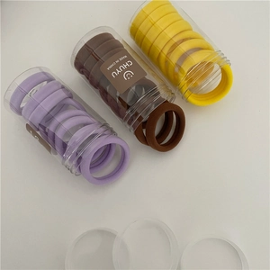 Candy colored elastic hair ties set in 3 jars for ponytail styling and thick hair