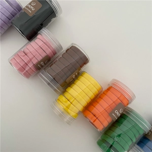 Colorful high-elastic hair ties set in a transparent cylinder container for ponytail styling