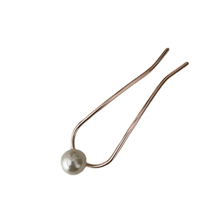 U-shaped hair pin in rose gold metal with a single white pearl minimalist hair accessory