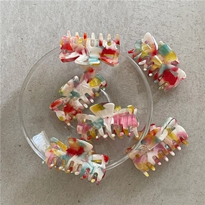 Set of 6 minimalist resin hair claws with colorful marble texture and sleek rectangle design