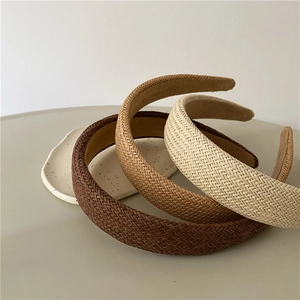 Three-color woven headbands in brown, beige and ivory with retro bohemian texture