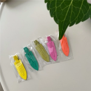 Set of five colorful neon hair clips in bright yellow, green, pink and orange colors
