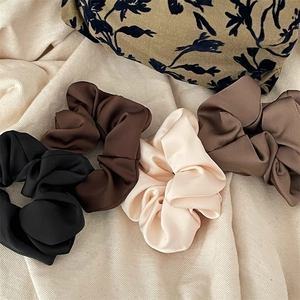 Set of 4 elegant satin scrunchies in black, brown, cream, and khaki colors