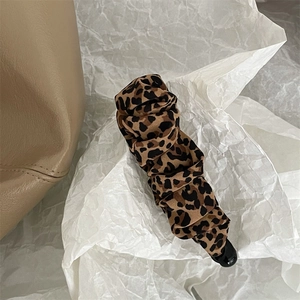 Elegant leopard print fabric banana hair clip with pleated texture for stylish women