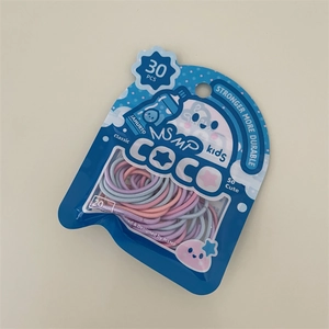 Dettaglio di 30 elastici per capelli colorati per bambini in confezione blu con finestra