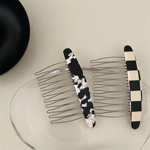 Minimalist marble and checkered hair comb set with gold metal teeth on glass tray