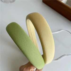 Padded sponge headbands in pastel green and yellow with fine twill fabric texture