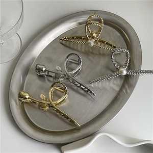 Elegant metallic silver rose and pearl hair claw set with stylish twisted rope design