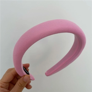 Detail of pink padded sponge headband featuring soft knit fabric and reinforced structure