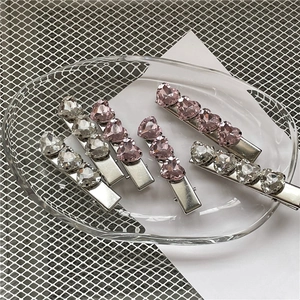 Set di cinque fermagli per capelli in metallo argento con strass a cuore rosa
