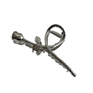 Elegant silver metallic rose hair claw clip with vintage twisted texture for hair styling