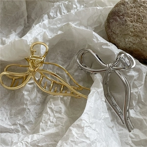 Eleganti mollette per capelli in metallo oro e argento con design a fiocco da donna