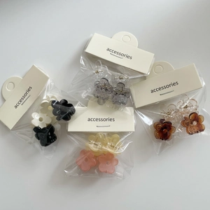 Mini flower hair claw clips set in jelly colors with clear plastic packaging