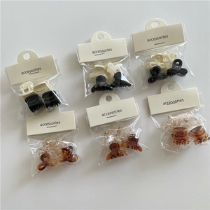 Detail view of 6-pack jelly color mini hair clips in bow and classic shapes