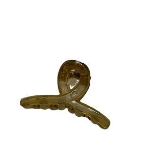 Minimalist jelly amber resin hair claw clip with cross spiral design and strong metal spring
