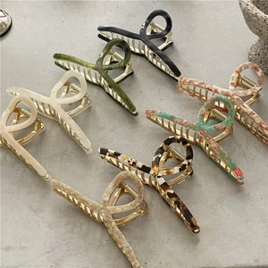 Selection of large 14cm acetate and alloy hair claws in seven elegant marble textures